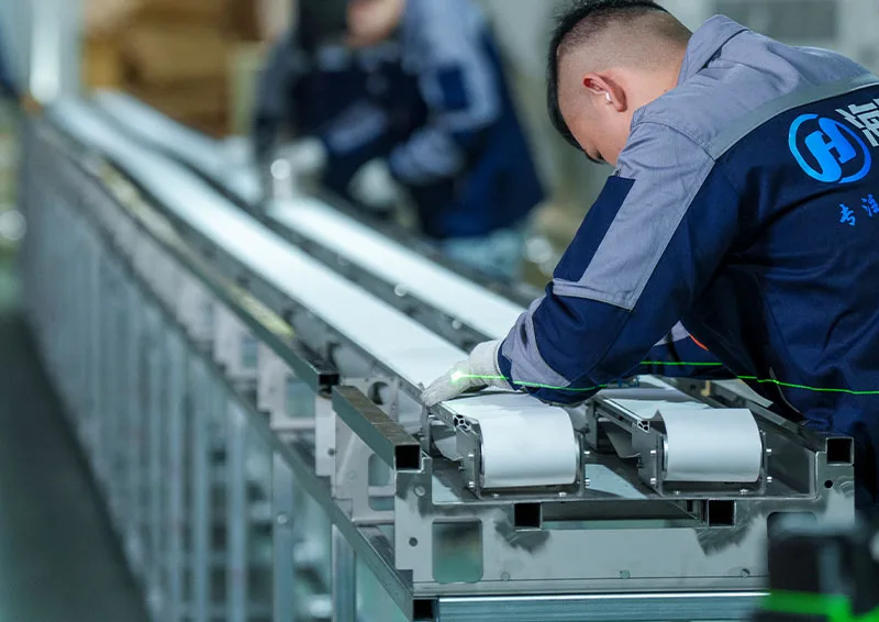 Technologie intelligente Haisheng : votre partenaire depuis 15 ans dans les solutions de restauration à convoyeur intelligent