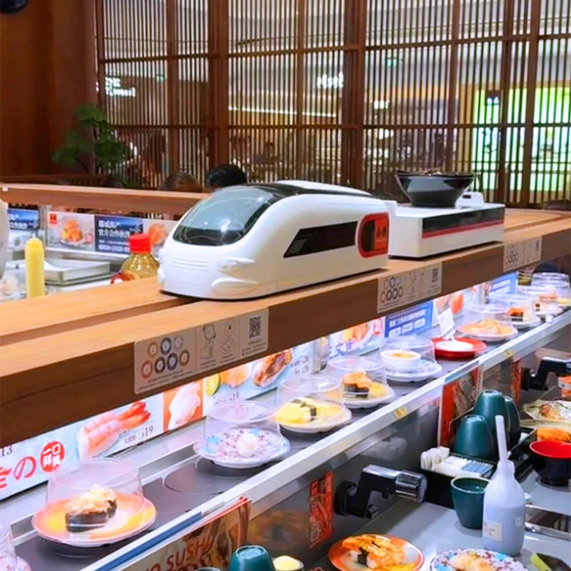 Système de convoyeur à sushi rotatif automatique